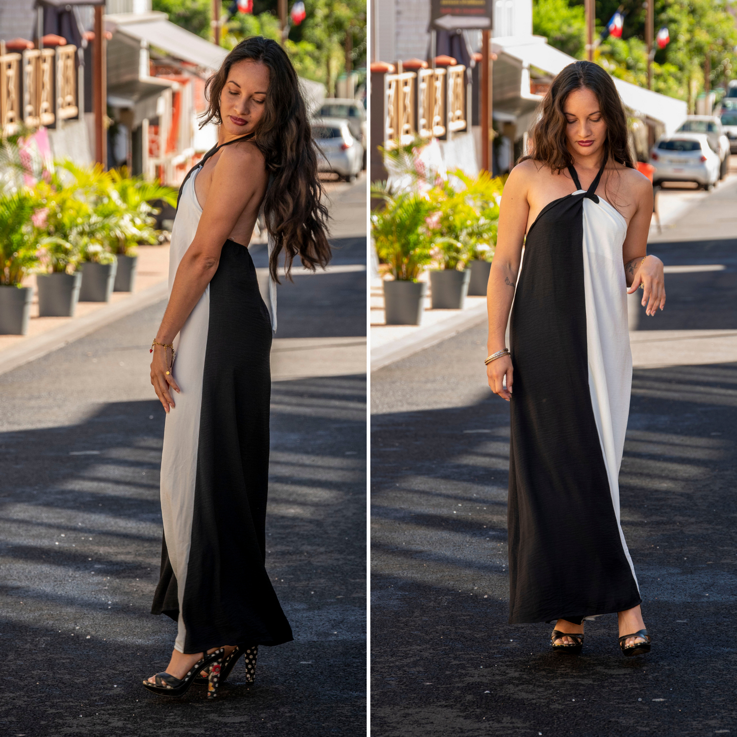 Femme portant une robe longue fluide dos nu bicolore noir et blanc dans une rue de Cilaos à l'île de la Réunion